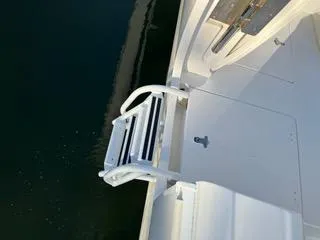  Yacht Photos Pics 2016 Intrepid 400 Center Console boat with a foldable swim ladder.