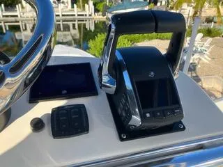  Yacht Photos Pics Control panel of a 2016 Intrepid 400 Center Console boat, featuring throttle and display.