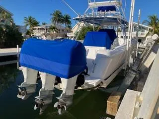  Yacht Photos Pics 2016 Intrepid 400 Center Console boat docked with blue engine covers.