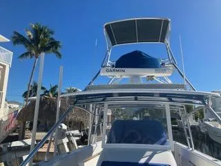  Yacht Photos Pics 2016 Intrepid 400 Center Console boat docked under clear blue sky.