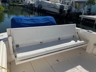  Yacht Photos Pics 2016 Intrepid 400 Center Console boat with foldable seating, docked near other boats.