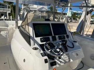  Yacht Photos Pics 2016 Intrepid 400 Center Console boat cockpit with modern navigation equipment.