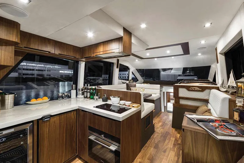  Yacht Photos Pics Manufacturer Provided Image: Luxurious interior of 2022 Galeon 460 Fly yacht with modern kitchen and dining area.