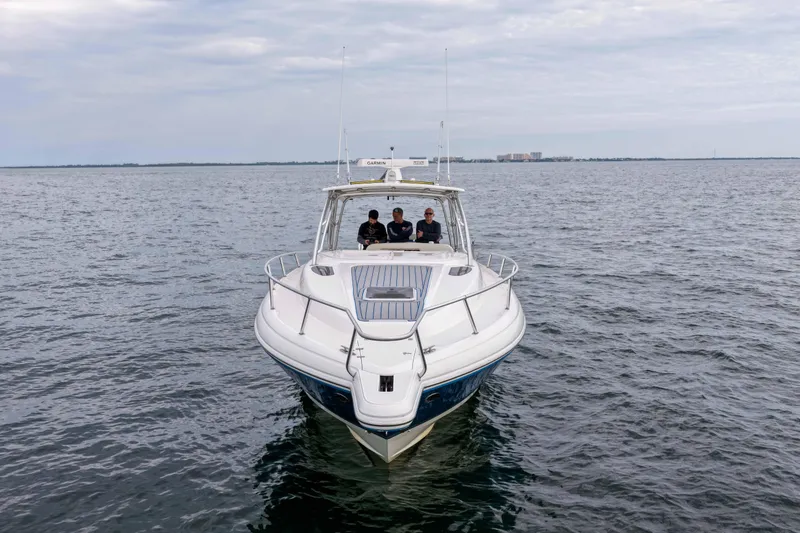  Yacht Photos Pics 2003 Intrepid 377 Walkaround boat cruising on open water.