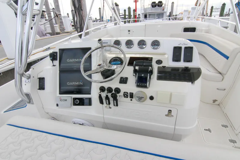  Yacht Photos Pics 2003 Intrepid 377 Walkaround boat dashboard with Garmin navigation and control systems.