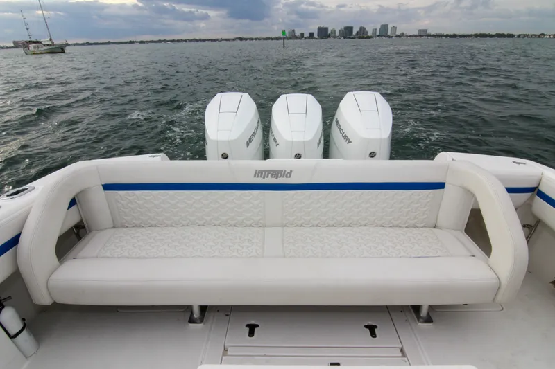  Yacht Photos Pics 2003 Intrepid 377 Walkaround boat with triple Mercury engines on open water.