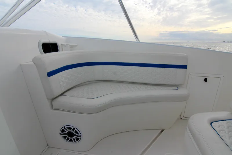  Yacht Photos Pics 2003 Intrepid 377 Walkaround boat interior seating with blue accents and ocean view.