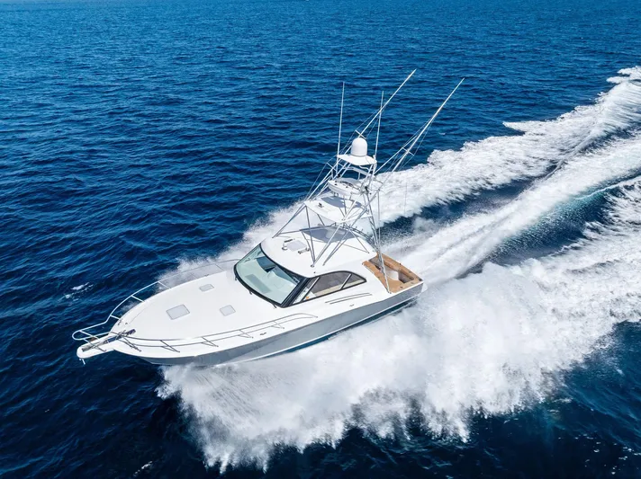 Milling Time Yacht Photos Pics 2016 Hatteras Express Sportfish cruising on open ocean waters.