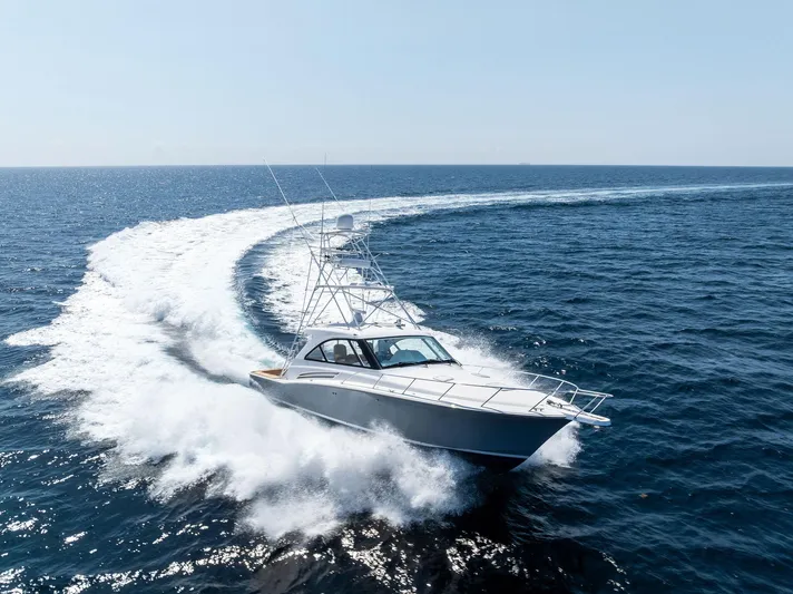 Milling Time Yacht Photos Pics 2016 Hatteras Express Sportfish cruising swiftly on open ocean waters.