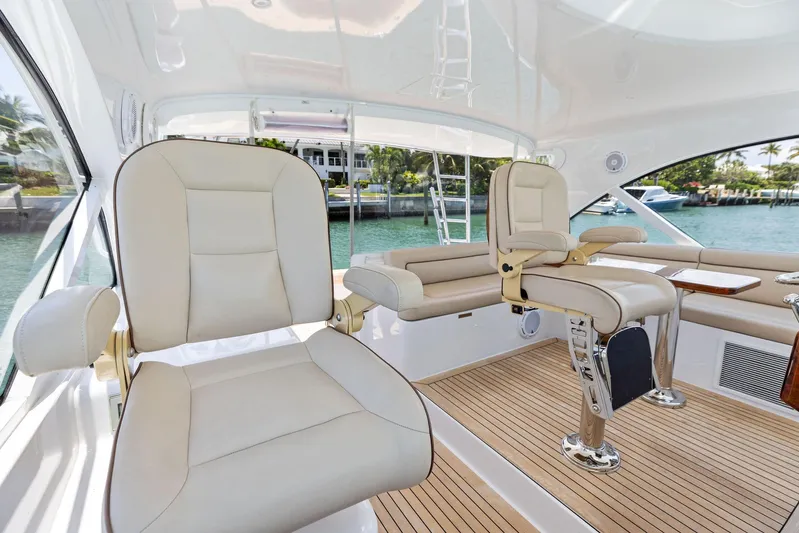 Milling Time Yacht Photos Pics 2016 Hatteras Express Sportfish interior with plush seating and sleek design.