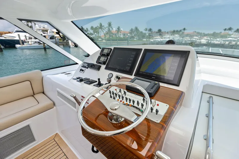 Milling Time Yacht Photos Pics 2016 Hatteras Express Sportfish helm with modern navigation displays and controls.
