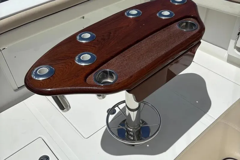  Yacht Photos Pics Luxury wooden table on 2017 Jupiter 38 FS boat with cup holders.