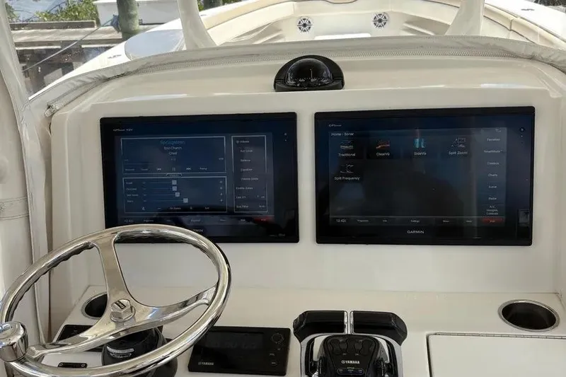  Yacht Photos Pics 2017 Jupiter 38 FS boat dashboard with dual Garmin displays and steering wheel.