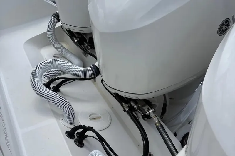  Yacht Photos Pics 2017 Jupiter 38 FS boat engines with cables and hoses in close-up view.