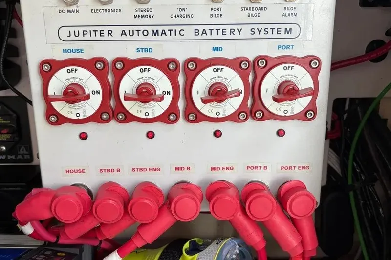  Yacht Photos Pics Jupiter 38 FS 2017 automatic battery system panel with red switches and labeled connections.