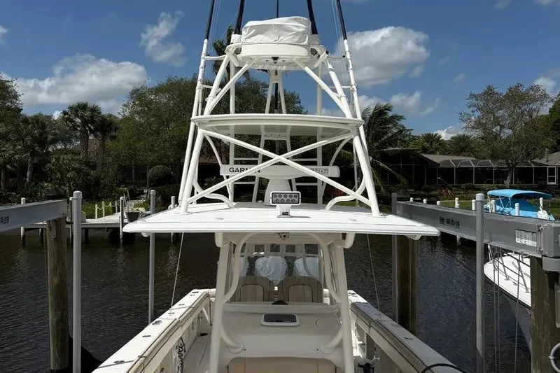  Yacht Photos Pics 2017 Jupiter 38 FS boat docked, featuring a tower and spacious deck.