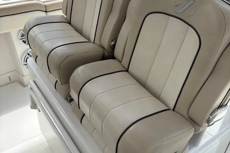  Yacht Photos Pics Luxurious beige seating on 2017 Jupiter 38 FS boat, featuring stylish black trim.