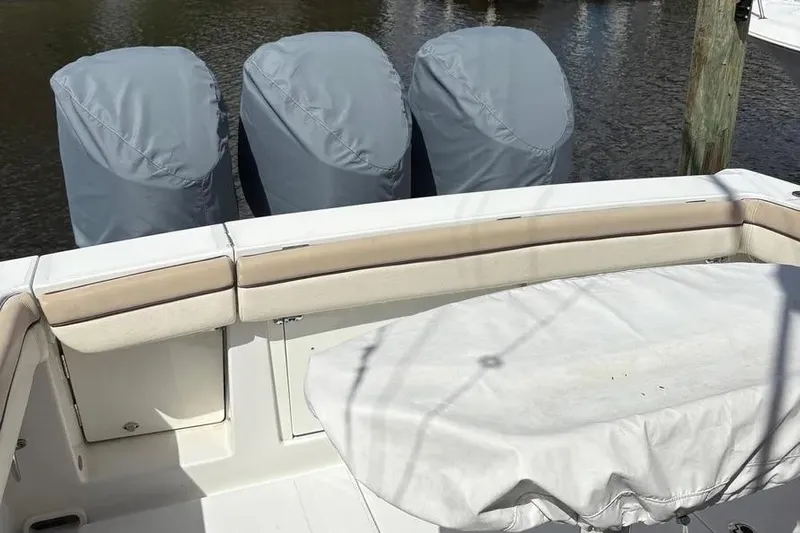  Yacht Photos Pics 2017 Jupiter 38 FS boat with covered engines and cushioned seating.