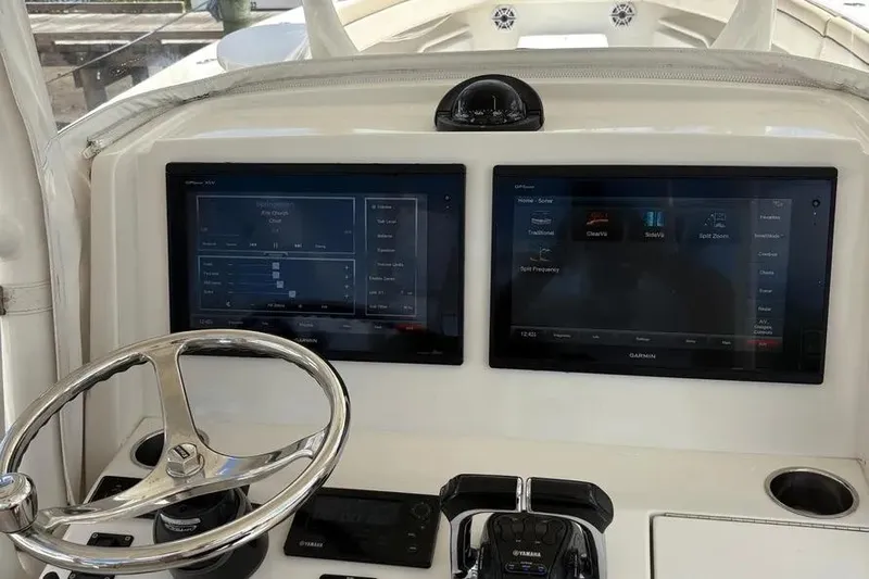  Yacht Photos Pics 2017 Jupiter 38 FS boat dashboard with dual Garmin displays and steering wheel.