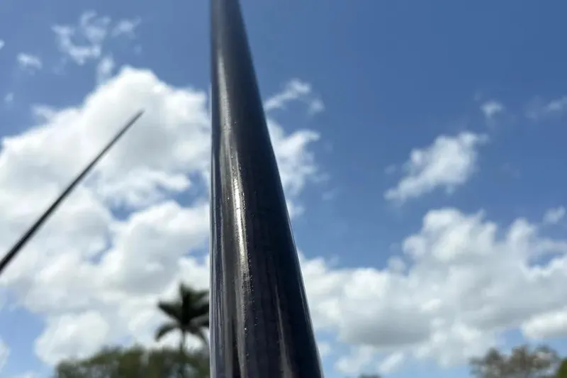  Yacht Photos Pics Close-up of a Jupiter 38 FS boat mast against a cloudy blue sky, 2017 model.