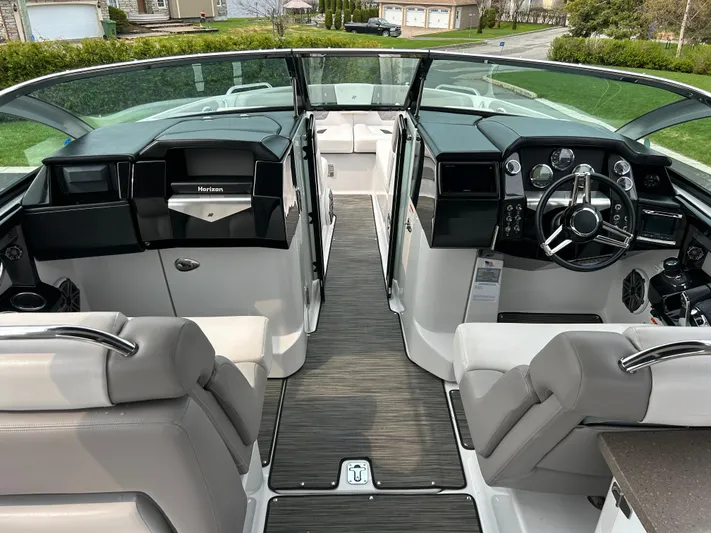  Yacht Photos Pics 2018 Four Winns Horizon H290 boat interior with dual consoles and modern dashboard.