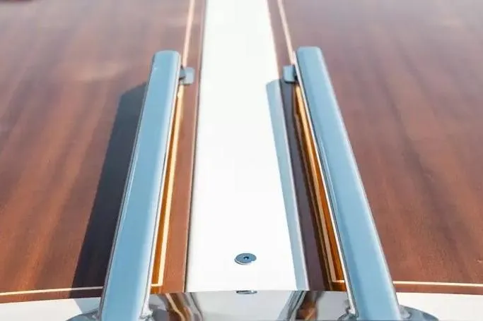 2022 Ecoline Marine Ecolux 850 boat deck with sleek wood and metal design.