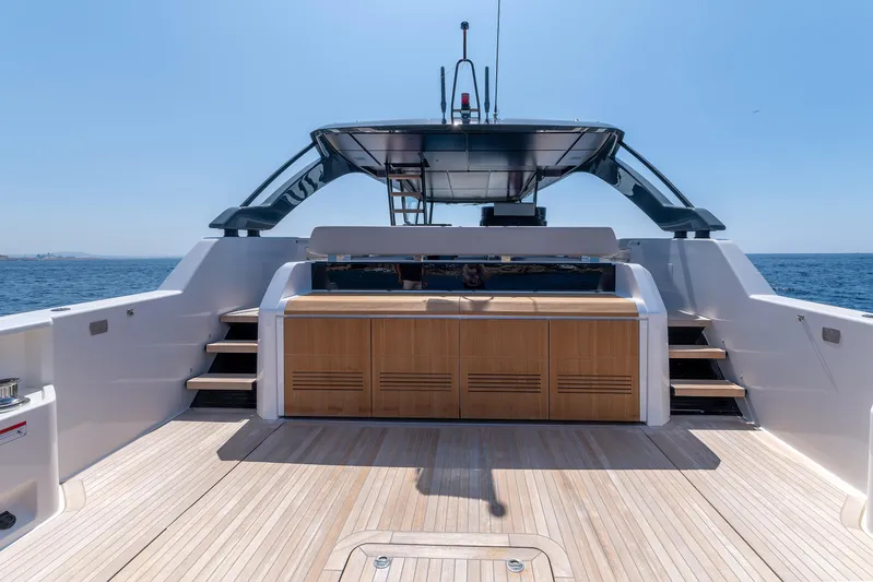  Yacht Photos Pics 2024 Bluegame 54 yacht deck with wooden flooring and ocean view.