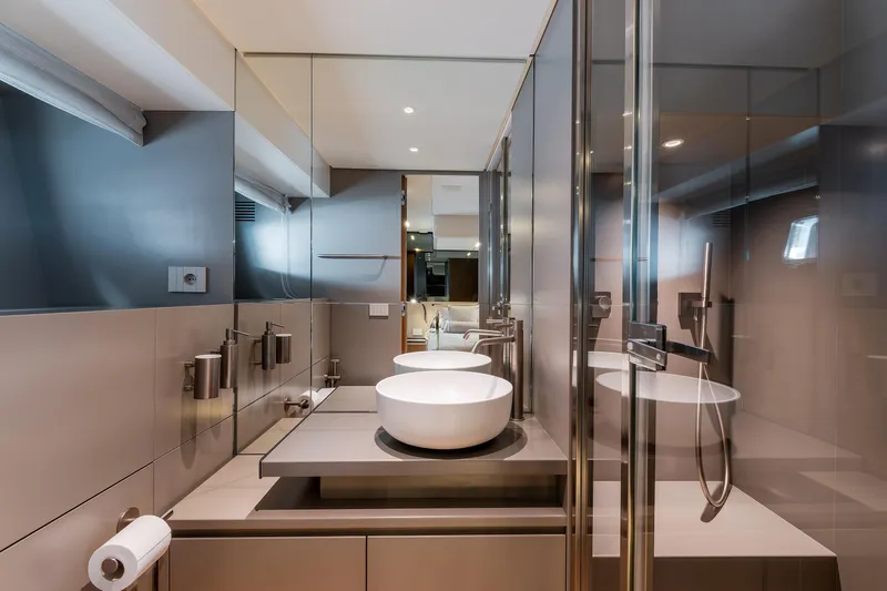  Yacht Photos Pics Luxurious bathroom interior on 2024 Bluegame 54 yacht, featuring modern fixtures and elegant design.