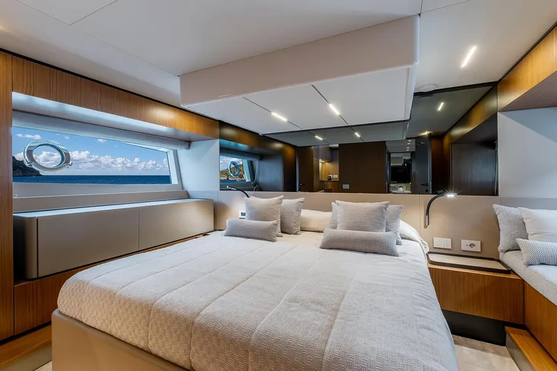  Yacht Photos Pics Luxurious 2024 Bluegame 54 yacht bedroom with ocean view and modern design.