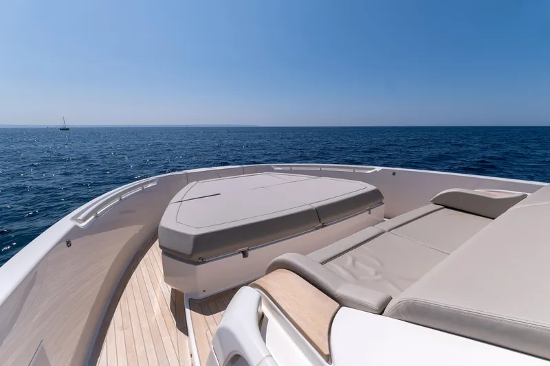  Yacht Photos Pics 2024 Bluegame 54 yacht deck with luxurious seating, overlooking the open sea.