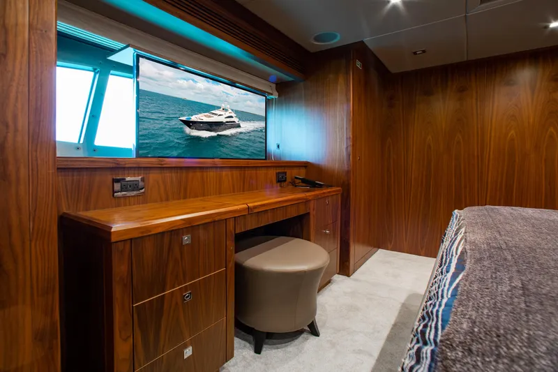 Marin Yacht Photos Pics Luxurious cabin interior of 2014 Sunseeker 131 yacht with wooden desk and TV.