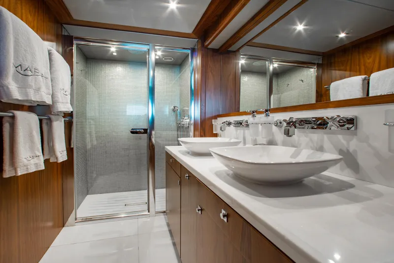 Marin Yacht Photos Pics Luxurious bathroom in 2014 Sunseeker 131 yacht with dual sinks and glass shower.