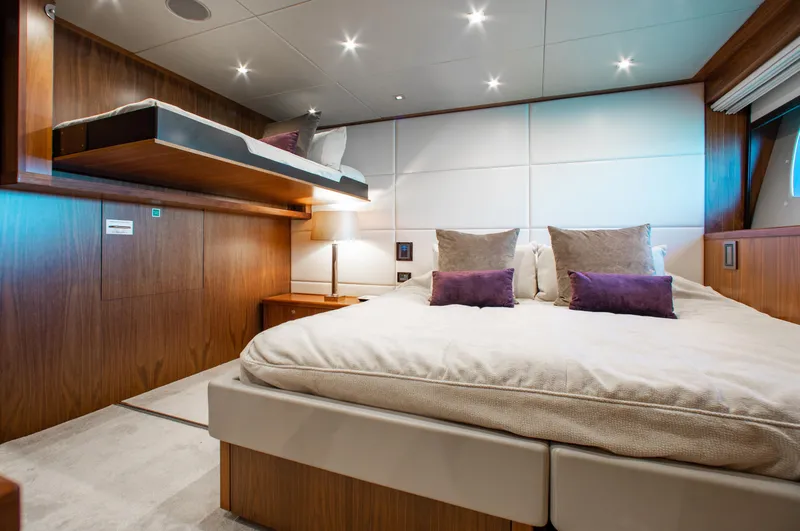 Marin Yacht Photos Pics Luxurious bedroom interior of 2014 Sunseeker 131 yacht with modern design and cozy bedding.