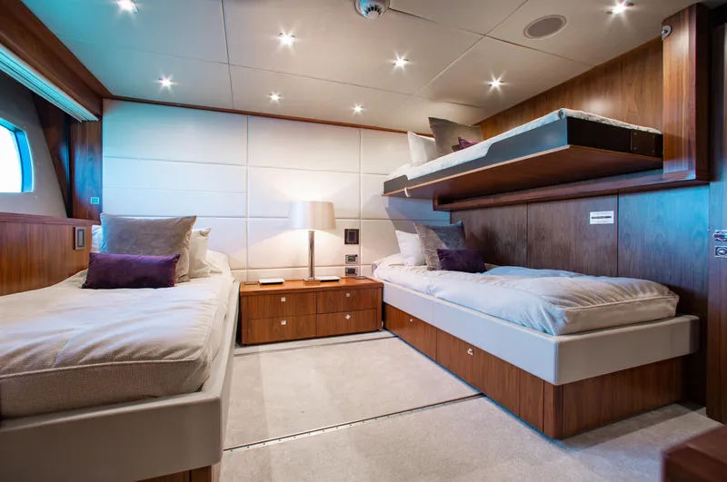 Marin Yacht Photos Pics Luxurious twin bedroom on 2014 Sunseeker 131 yacht with modern decor and ambient lighting.