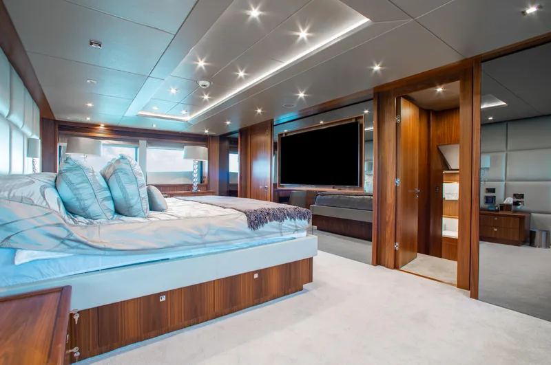 Marin Yacht Photos Pics Luxurious bedroom interior of 2014 Sunseeker 131 yacht with modern design and wooden accents.