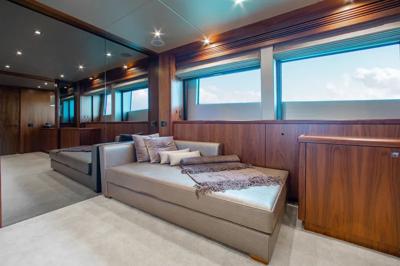 Marin Yacht Photos Pics Luxurious interior of 2014 Sunseeker 131 yacht with modern furnishings and large windows.