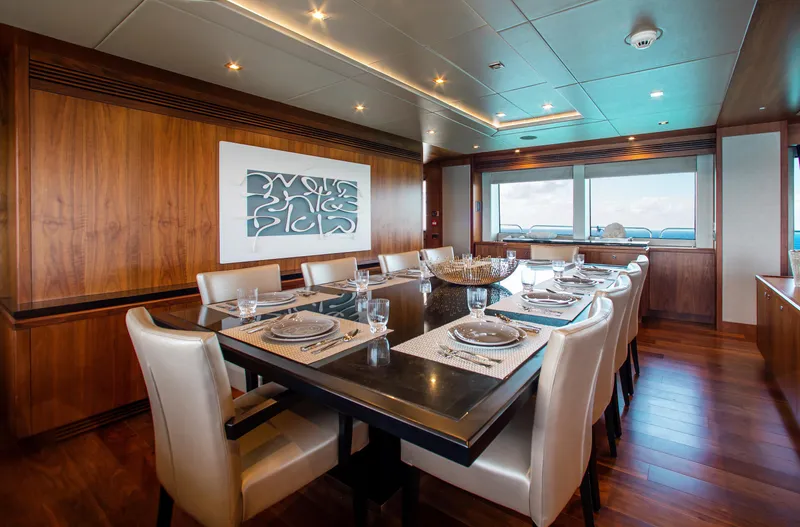 Marin Yacht Photos Pics Luxurious dining area on a 2014 Sunseeker 131 yacht with elegant table setting.