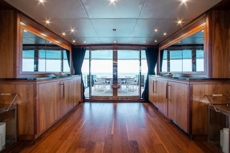 Marin Yacht Photos Pics Luxurious interior of 2014 Sunseeker 131 yacht with wooden flooring and ocean view.