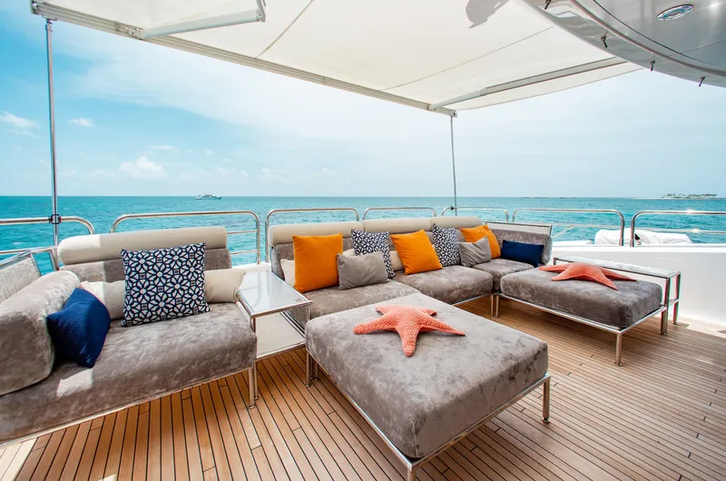 Marin Yacht Photos Pics Luxurious deck seating on 2014 Sunseeker 131 yacht with ocean view.