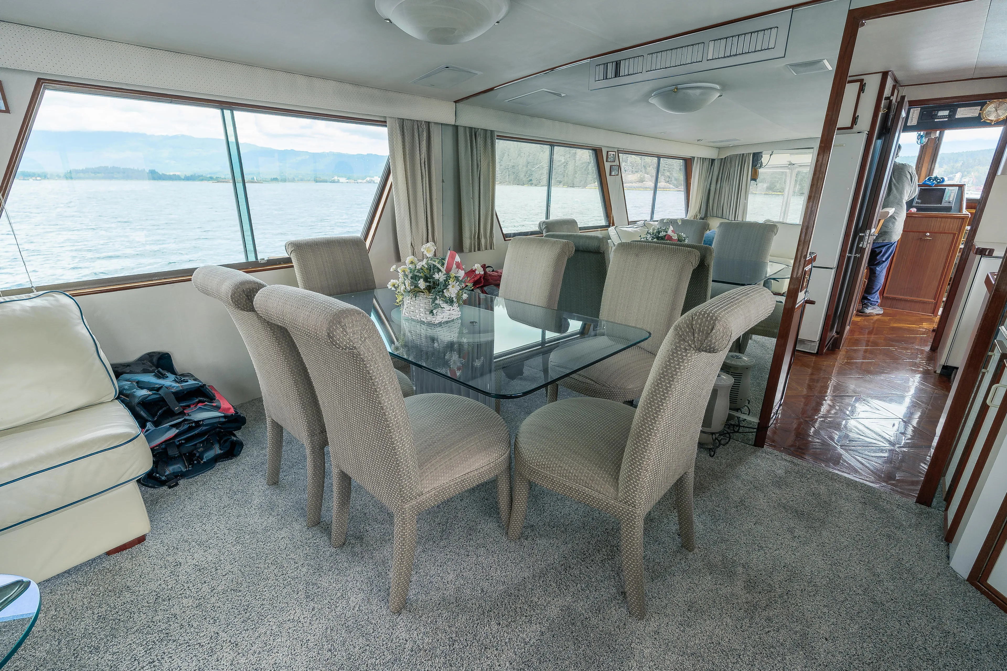  Yacht Photos Pics Interior of 1983 Hatteras Pleasure Craft with dining area and panoramic windows.