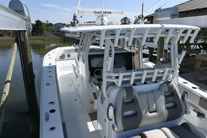  Yacht Photos Pics 2022 Freeman 37VH boat docked, featuring advanced Garmin navigation system and spacious seating.