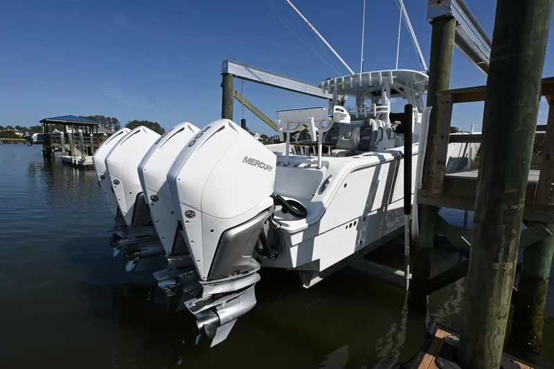  Yacht Photos Pics 2022 Freeman 37VH boat with triple Mercury outboard engines docked at a marina.