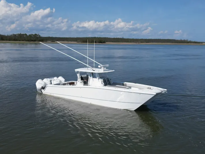  Yacht Photos Pics 2022 Freeman 37VH boat on calm water under blue sky.