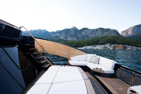  Yacht Photos Pics Luxurious 2023 Lazzara LSX yacht deck with scenic mountain and sea view.
