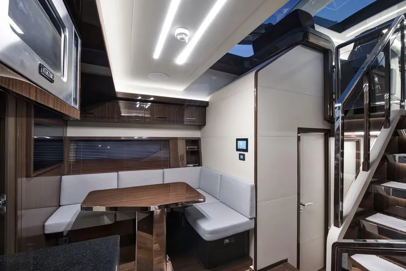  Yacht Photos Pics Luxurious interior of 2023 Lazzara LSX yacht with modern seating and sleek design.