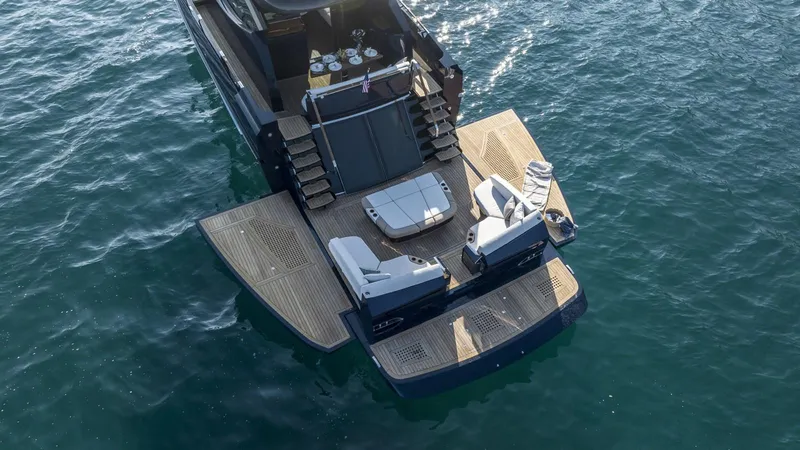  Yacht Photos Pics 2023 Lazzara LSX yacht with spacious deck and seating on calm water.