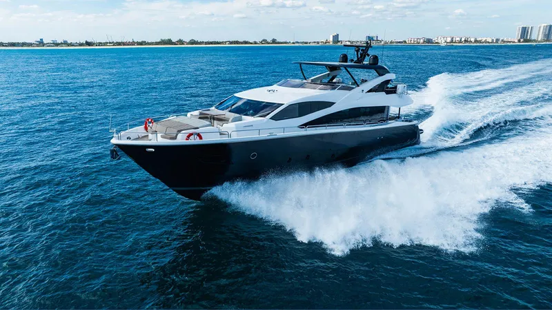 Golden Ours Yacht Photos Pics 2019 Sunseeker Motoryacht cruising on open water, showcasing sleek design and luxury.