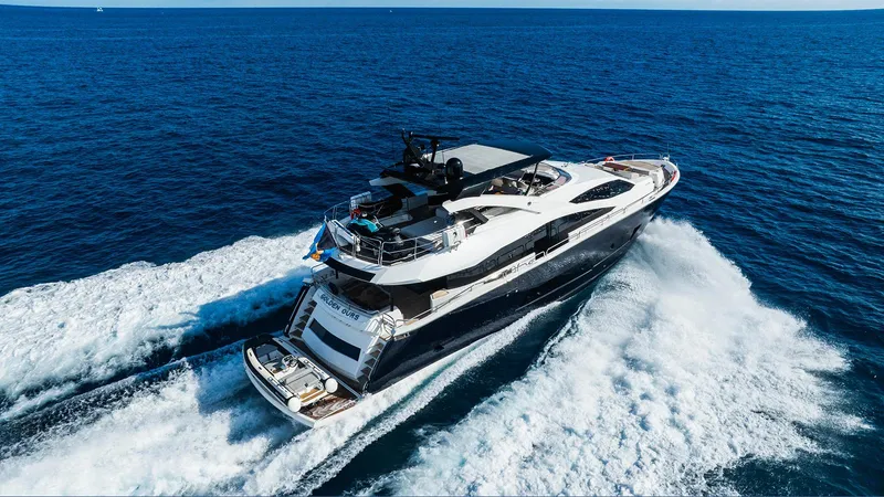 Golden Ours Yacht Photos Pics Luxurious 2019 Sunseeker Motoryacht cruising on open sea, creating dynamic waves.