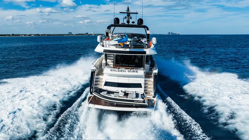 Golden Ours Yacht Photos Pics 2019 Sunseeker Motoryacht cruising on open sea, leaving a wake behind.