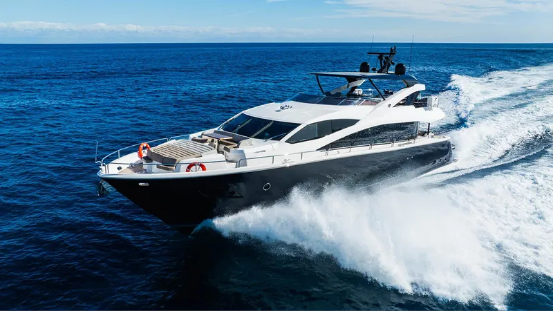 Golden Ours Yacht Photos Pics 2019 Sunseeker Motoryacht cruising on open sea, creating dynamic waves.